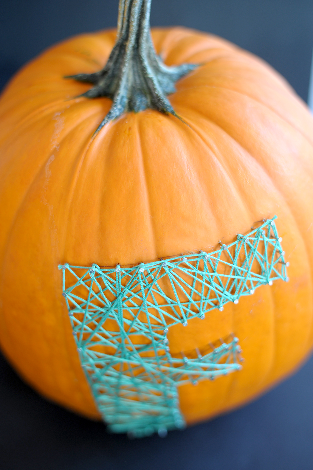 diy string art pumpkin